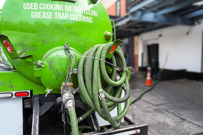 grease trap being pumped out by service technician in Alviso CA